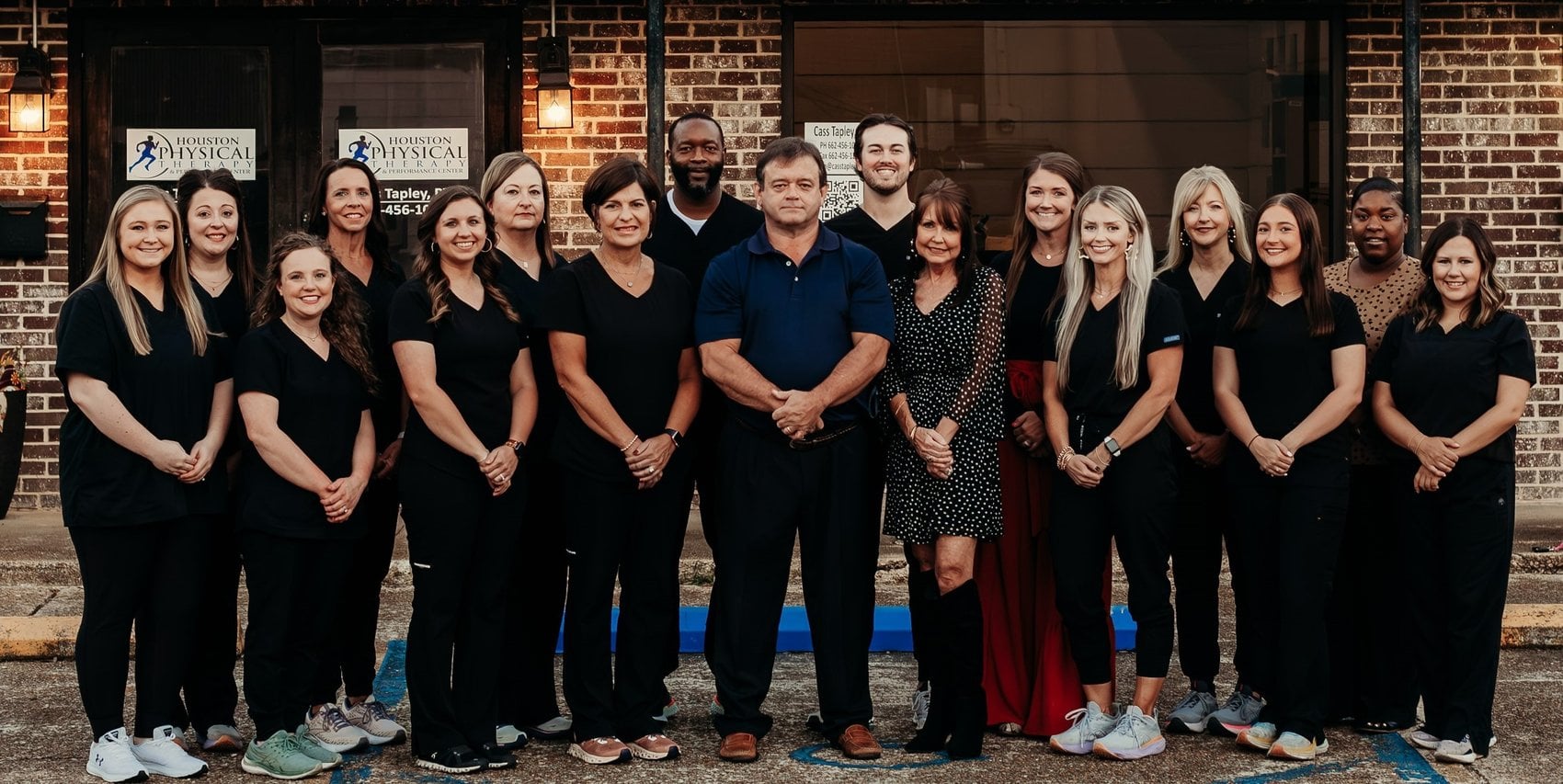 The Houston Physical Therapy & Performance Center team outside their clinic on the square in Houston, MS