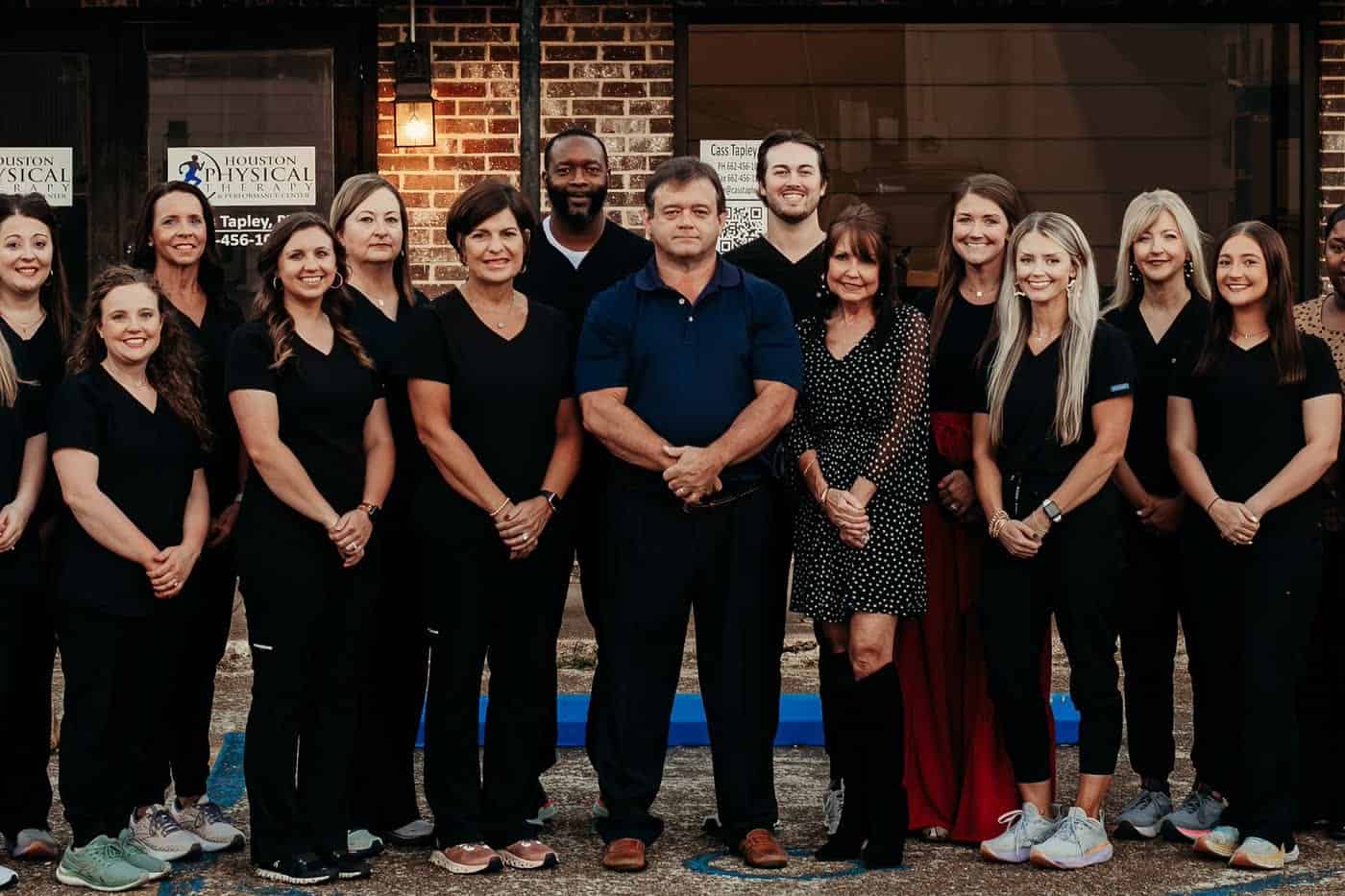 The Houston Physical Therapy & Performance Center team in front of their clinic on the square in Houston, Mississippi
