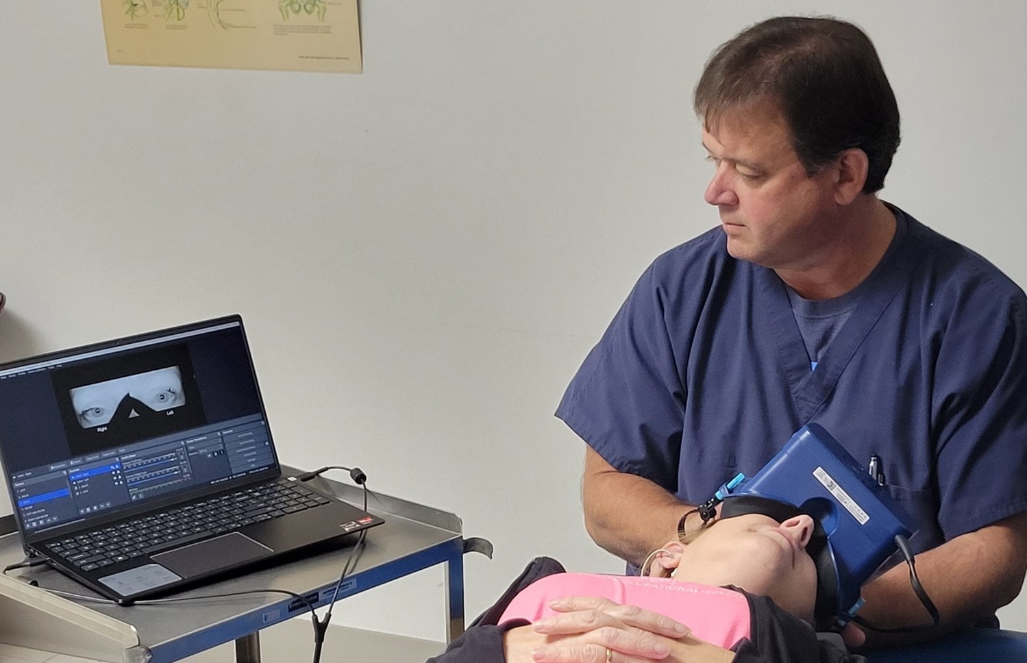 Houston Physical Therapy clinician performing computerized vestibular and balance testing on a patient